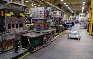 CTD Molds Background Commercial Tool Group Tool and Die Shop Floor showing multiple plastic injection molds