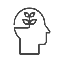 icon of a head facing sideways with a plant symbol inside of it depicting mindset